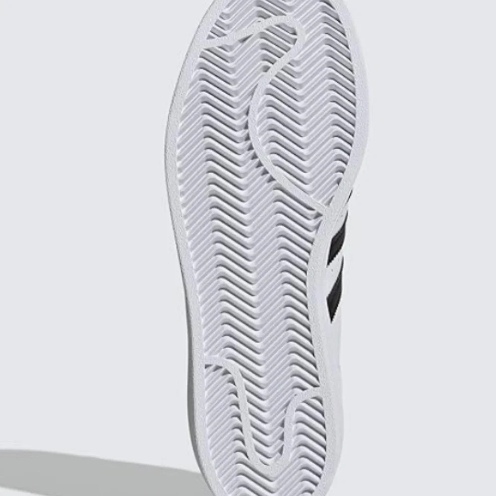 adidas Women’s White Sneakers with Black Stripes